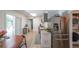 Charming kitchen featuring stainless steel appliances, ample counter space, and convenient access to laundry at 503 Rising Dr, Woodstock, GA 30189