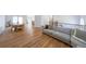 Open-concept living area with hardwood floors, comfortable seating, and natural light at 503 Rising Dr, Woodstock, GA 30189