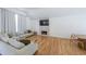 Cozy living room with a comfortable sofa, fireplace, and light hardwood flooring at 503 Rising Dr, Woodstock, GA 30189