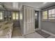 Bright bathroom featuring dual sinks, neutral-toned counters, and a shower, ideal for a refreshing and modern space at 1530 Niskey Lake Sw Trl, Atlanta, GA 30331