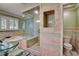 A bathroom features a glass enclosed shower, soaking tub and marble surround at 1530 Niskey Lake Sw Trl, Atlanta, GA 30331