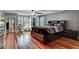 This primary bedroom features hardwood floors, natural light and an ensuite bath at 1530 Niskey Lake Sw Trl, Atlanta, GA 30331