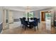 Charming dining room with elegant decor, neutral colors, and seamless backyard views at 1530 Niskey Lake Sw Trl, Atlanta, GA 30331