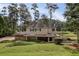 Charming two-story home with stone accents, mature trees, and manicured lawn at 1530 Niskey Lake Sw Trl, Atlanta, GA 30331