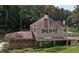 Charming two-story home with stone foundation, landscaped yard and lush landscaping at 1530 Niskey Lake Sw Trl, Atlanta, GA 30331