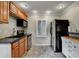 Cozy kitchen with stainless steel appliances, wooden cabinets, and granite countertops at 1530 Niskey Lake Sw Trl, Atlanta, GA 30331