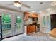 Cozy kitchen with stainless steel appliances, wooden cabinets, and a door to the wooden deck at 1530 Niskey Lake Sw Trl, Atlanta, GA 30331