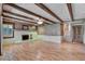 Spacious living room features exposed beam ceilings and a whitewashed brick fireplace at 1530 Niskey Lake Sw Trl, Atlanta, GA 30331