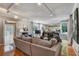 Bright and airy living room featuring hardwood floors, track lighting, and access to back deck at 1530 Niskey Lake Sw Trl, Atlanta, GA 30331