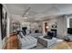 Open living space featuring hardwood floors, neutral paint, and plenty of seating at 1530 Niskey Lake Sw Trl, Atlanta, GA 30331