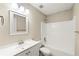 Clean bathroom with a tub/shower combination and a vanity with ample counter space at 2004 Township Dr, Woodstock, GA 30189