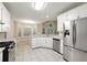 Bright eat-in kitchen featuring white cabinets, granite countertops, and stainless steel appliances at 2004 Township Dr, Woodstock, GA 30189