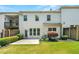 Backyard featuring manicured lawn, patio area, privacy fence, and a view of the home's exterior at 3541 Ashcroft Se Dr, Smyrna, GA 30080