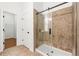 Bathroom with tiled shower with sliding glass doors and doorway to walk-in closet at 3541 Ashcroft Se Dr, Smyrna, GA 30080