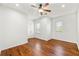 Spacious bedroom featuring hardwood floors and a ceiling fan at 3541 Ashcroft Se Dr, Smyrna, GA 30080