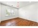 Bright bedroom featuring hardwood floors and a crystal chandelier at 3541 Ashcroft Se Dr, Smyrna, GA 30080