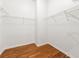 Walk-in closet with wood floor and metal shelving at 3541 Ashcroft Se Dr, Smyrna, GA 30080