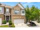 Two-story brick home with a front-facing garage, mature landscaping, and a well-manicured lawn at 3541 Ashcroft Se Dr, Smyrna, GA 30080