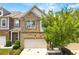 Two-story brick home with a front-facing garage, mature landscaping, and a well-manicured lawn at 3541 Ashcroft Se Dr, Smyrna, GA 30080