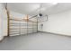 Clean, oversized garage with epoxy floors, overhead lighting, and automatic door at 3541 Ashcroft Se Dr, Smyrna, GA 30080