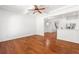 Spacious living room with hardwood floors, tray ceilings, and an open concept design into dining and kitchen at 3541 Ashcroft Se Dr, Smyrna, GA 30080