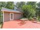 Exterior view showcasing a wood deck, table, grill, lush trees, and house siding at 4411 Westerling Ct, Powder Springs, GA 30127