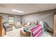 Relaxing basement with comfortable seating, bright window, and ample living space at 4411 Westerling Ct, Powder Springs, GA 30127