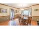 Elegant dining room featuring hardwood floors and stylish decor at 4411 Westerling Ct, Powder Springs, GA 30127