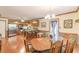 Bright dining room with hardwood floors and an open view into the kitchen at 4411 Westerling Ct, Powder Springs, GA 30127