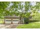 Charming two-story home featuring a stone facade, a welcoming front porch, and a well-maintained lawn at 4411 Westerling Ct, Powder Springs, GA 30127