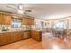 Spacious kitchen and dining area with hardwood floors and ample natural light at 4411 Westerling Ct, Powder Springs, GA 30127