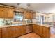 Kitchen boasts wooden cabinets, stainless steel appliances, and a breakfast bar at 4411 Westerling Ct, Powder Springs, GA 30127