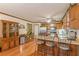 Eat-in kitchen with stainless steel appliances, breakfast bar and wooden cabinetry at 4411 Westerling Ct, Powder Springs, GA 30127