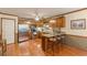 Well-lit kitchen with stainless steel appliances, wood cabinets, and breakfast bar at 4411 Westerling Ct, Powder Springs, GA 30127