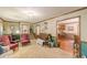 Large living room with staircase and hardwood floors leading to the kitchen at 4411 Westerling Ct, Powder Springs, GA 30127