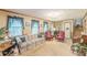 Comfortable living room with traditional furnishings, a piano, and ample space at 4411 Westerling Ct, Powder Springs, GA 30127