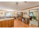 Open concept dining and living space with wood floors and natural light at 4411 Westerling Ct, Powder Springs, GA 30127