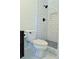 Bathroom featuring subway tile shower, modern fixtures, and hexagonal floor tiles at 5974 Sw Four Winds Sw Dr, Lilburn, GA 30047