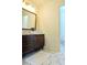 Bathroom vanity with vessel sink, modern faucet, and hexagonal tile flooring at 5974 Sw Four Winds Sw Dr, Lilburn, GA 30047