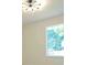 Bright bedroom with large window showcasing a tree-lined yard at 5974 Sw Four Winds Sw Dr, Lilburn, GA 30047