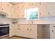 Updated kitchen showcasing white cabinets, stainless steel appliances, and stylish countertops at 5974 Sw Four Winds Sw Dr, Lilburn, GA 30047