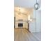 Spacious kitchen featuring white cabinets, stainless steel appliances, and hardwood floors at 5974 Sw Four Winds Sw Dr, Lilburn, GA 30047