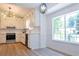 Modern kitchen with white cabinets, stainless steel appliances, and stylish backsplash at 5974 Sw Four Winds Sw Dr, Lilburn, GA 30047