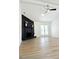 Spacious living room featuring wood-look floors, a fireplace, and vaulted ceiling at 5974 Sw Four Winds Sw Dr, Lilburn, GA 30047