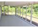 Enclosed, screened in porch for enjoying the outdoors at 5974 Sw Four Winds Sw Dr, Lilburn, GA 30047