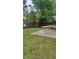 Backyard featuring a patio with outdoor furniture, surrounded by grass and a wooden fence for privacy at 6265 Gemstone Ct, South Fulton, GA 30349