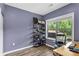 Comfortable bedroom features a view to the landscaped yard at 935 Grove Valley Drive Dr, Cumming, GA 30041