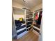 Walk-in closet complete with shelving, drawers, and ample storage space, offering optimal organization at 935 Grove Valley Drive Dr, Cumming, GA 30041