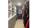 Walk-in closet featuring custom shelves, drawers, and hanging rods for optimal clothing and accessory organization at 935 Grove Valley Drive Dr, Cumming, GA 30041