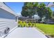 Spacious backyard with a concrete patio, lush green lawn, and a charming garden at 499 Running Doe Ct, Suwanee, GA 30024